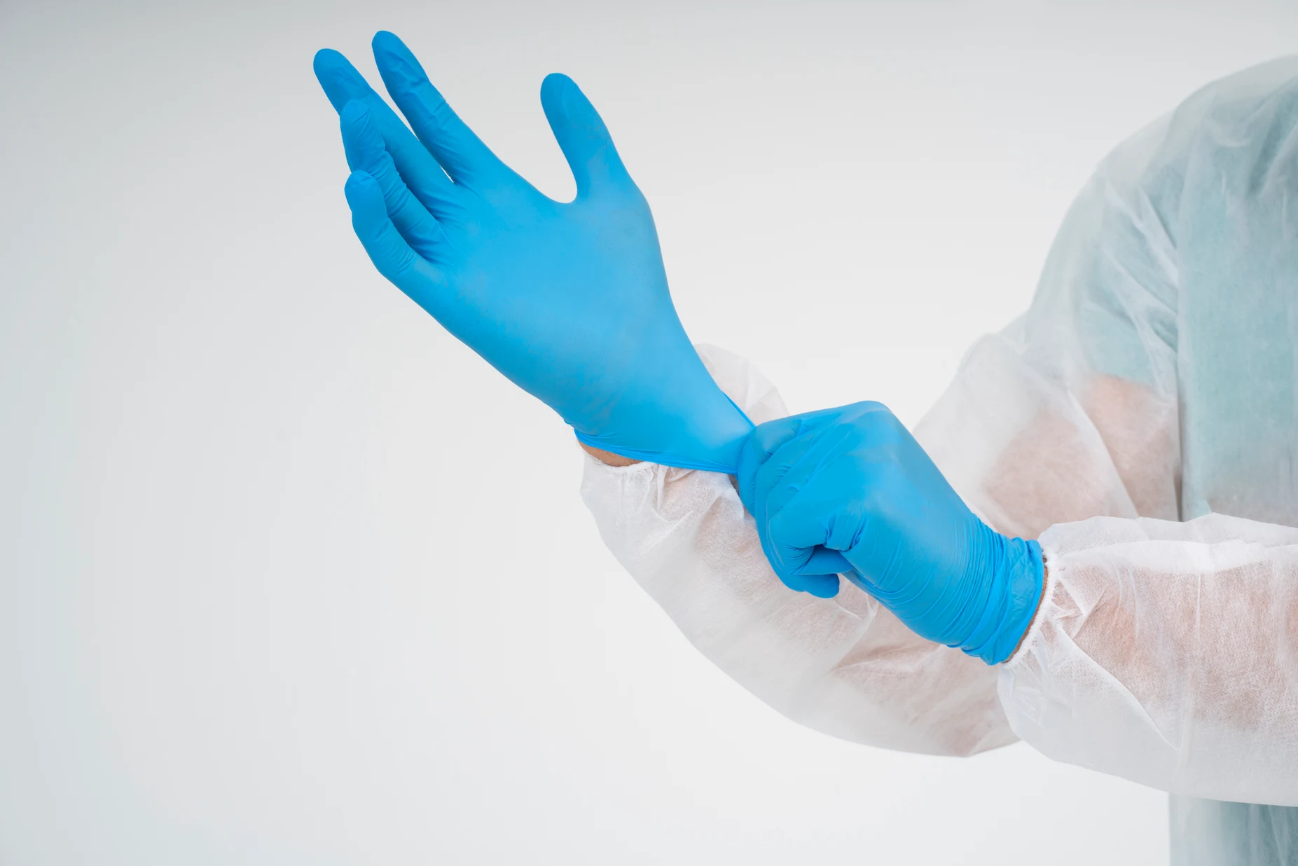 side-view-doctor-putting-glove